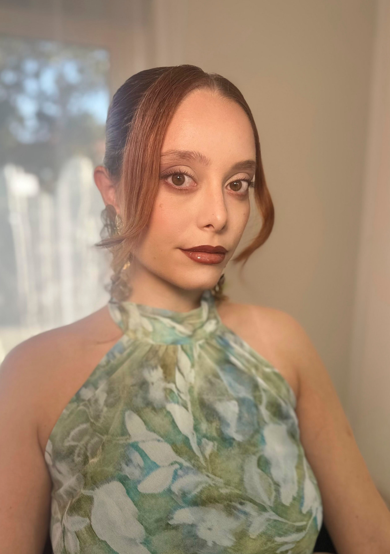 Soft glam makeup by Christina with sculpted brows and a deep berry lip